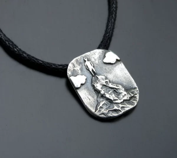 Silver victory pendant - a man on high mountain